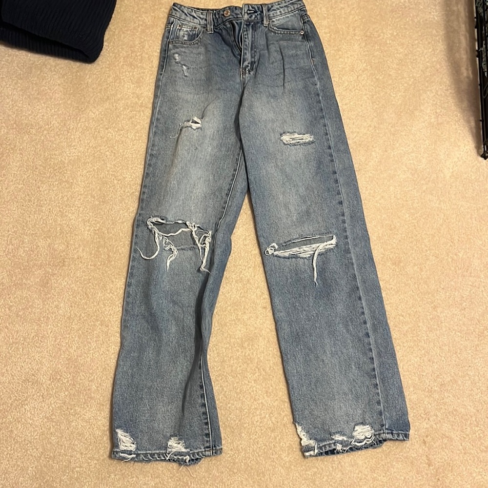 light blue slightly ripped jeans